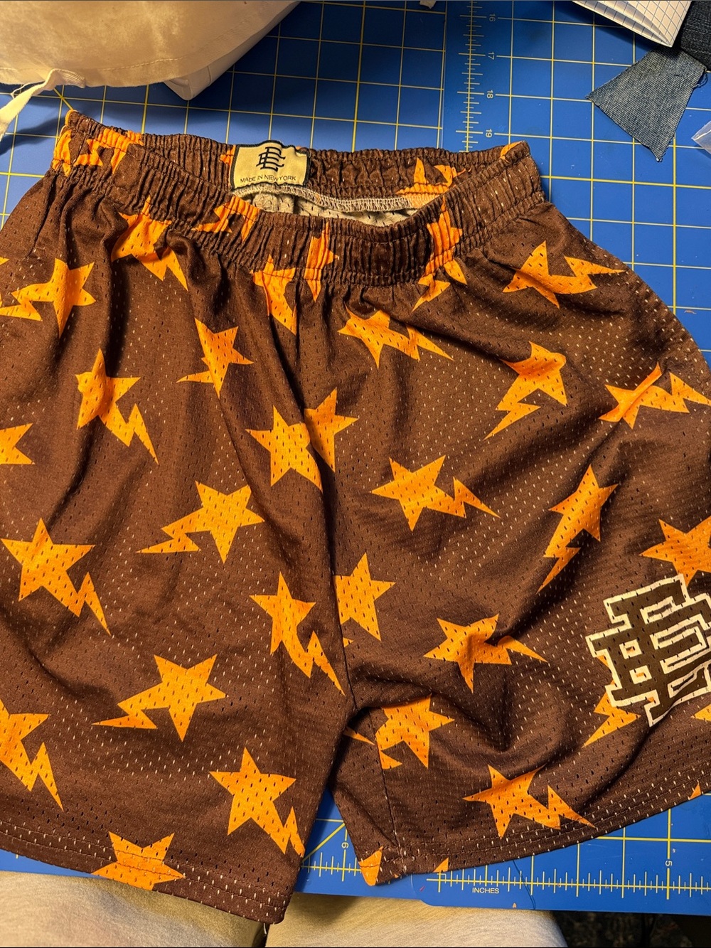 Eric Emanuel Brown Athletic Shorts with Orange Star & Lightning Print